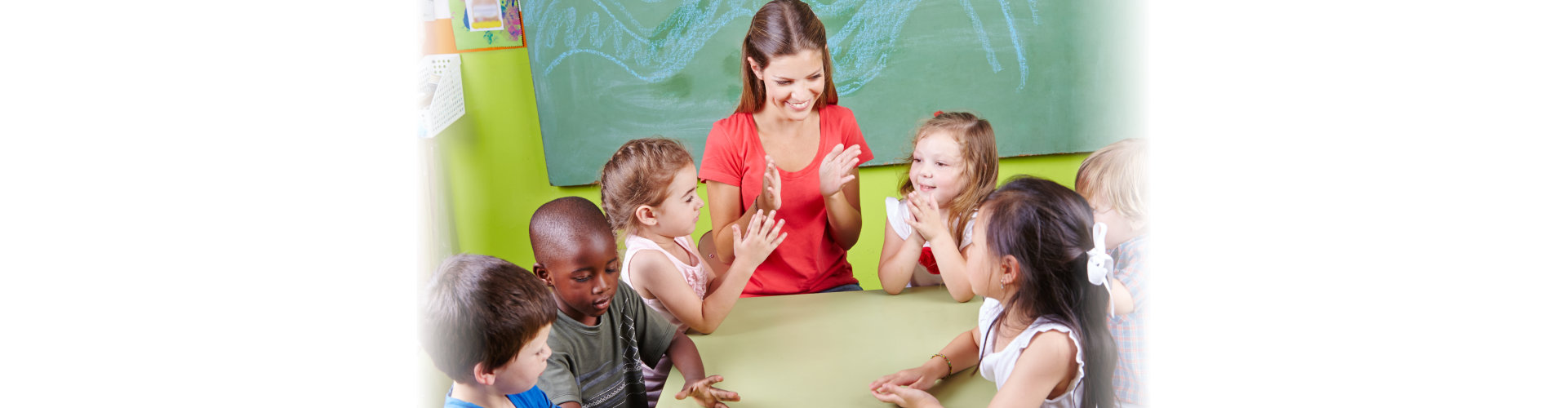 Teacher clapping with students